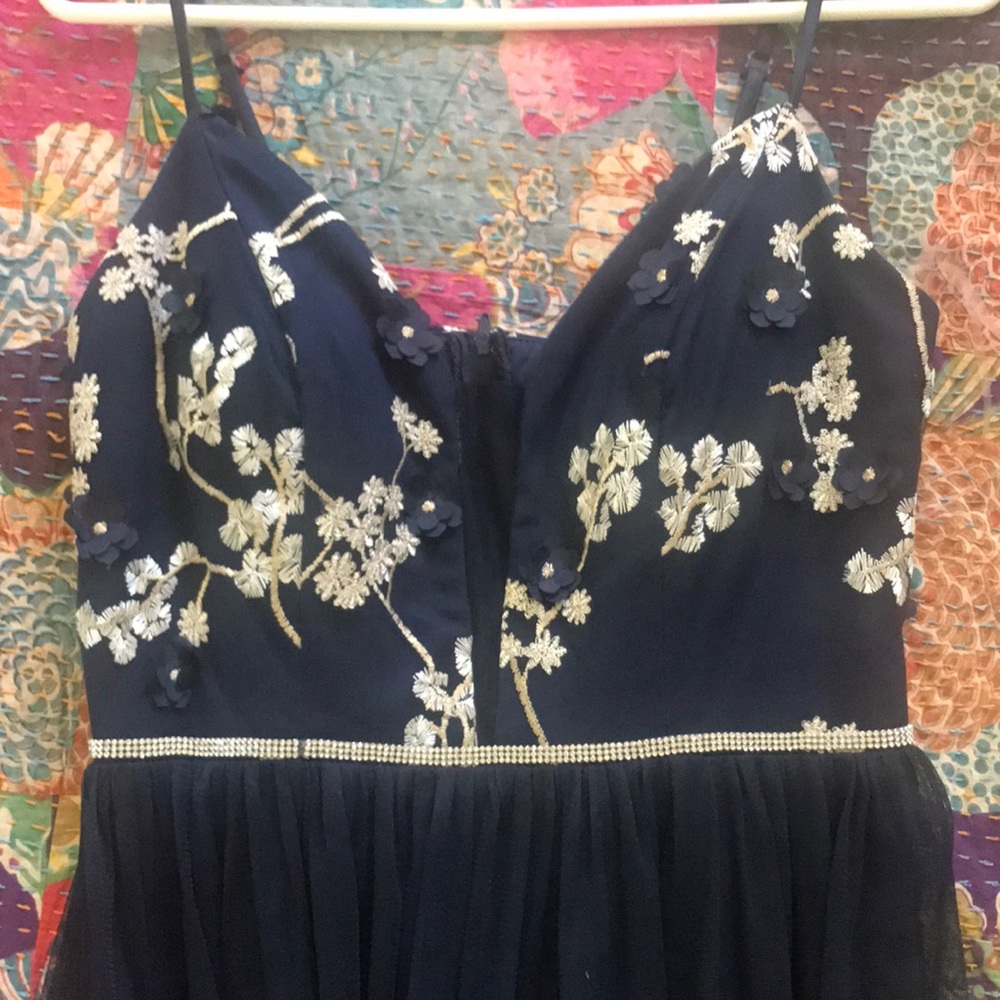 used prom dress, worn once! navy blue, floral top and gauzy bottom.